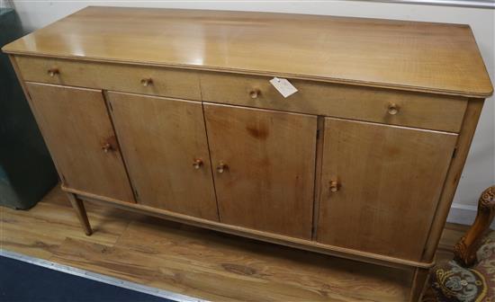 A Gordon Russell walnut dining suite table 152cm extended